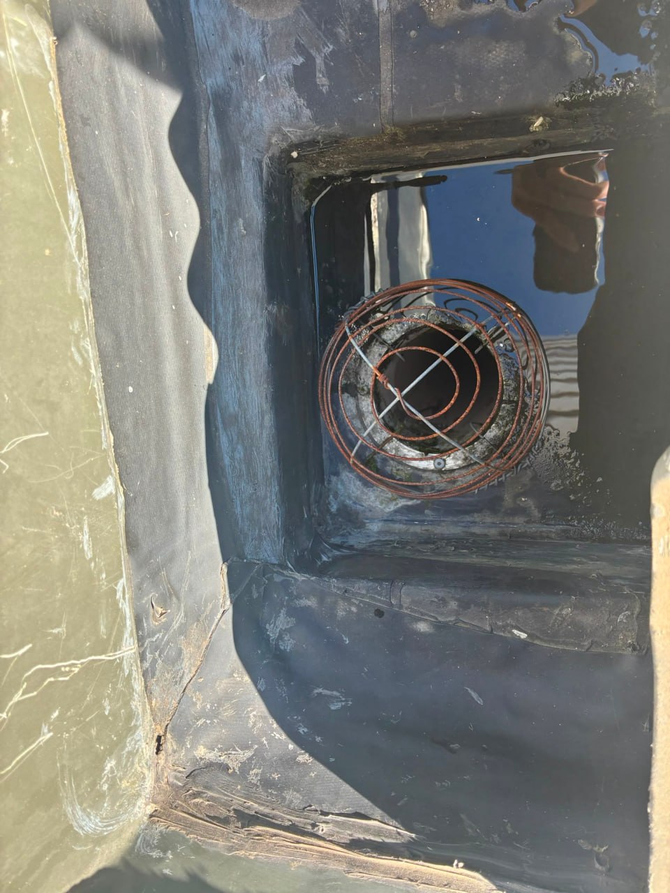 Rusted vent penetration with failed sealant