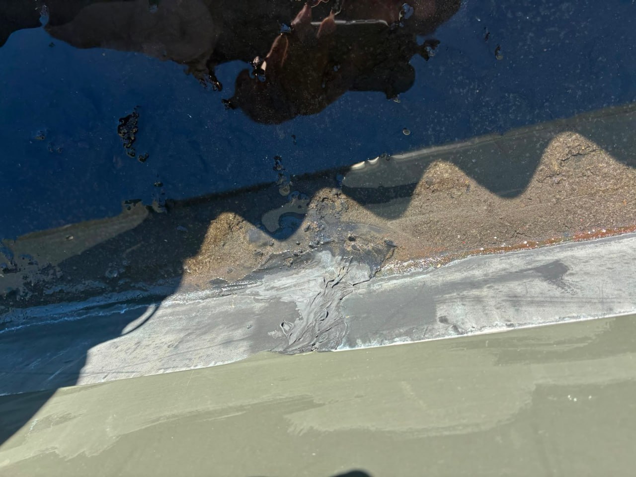Roof inspection by Envelope Roofing — aerial view showing ponding water