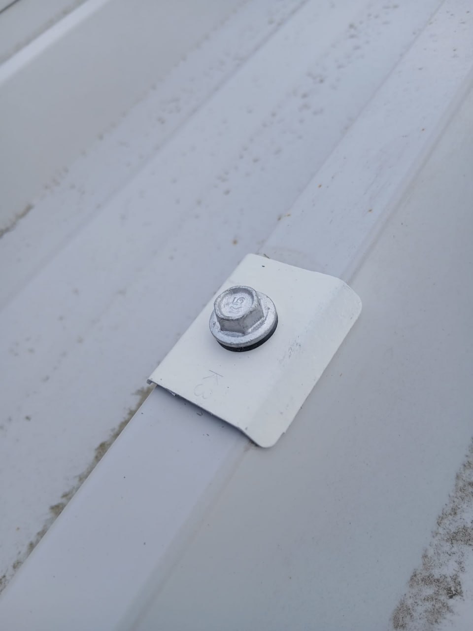 New fastener installed with neoprene washer