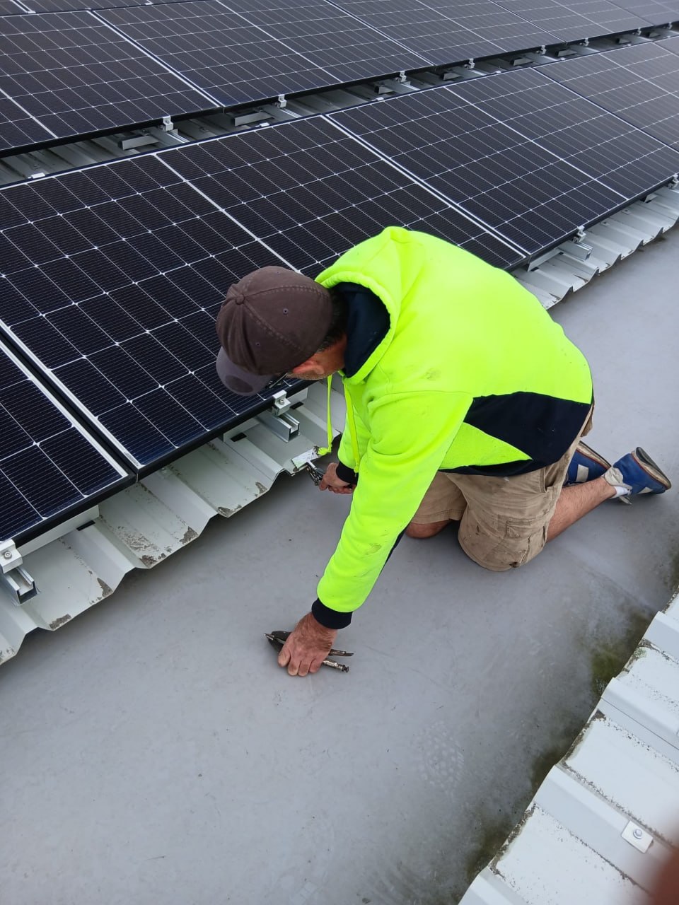 Envelope Roofing technician working at roof level